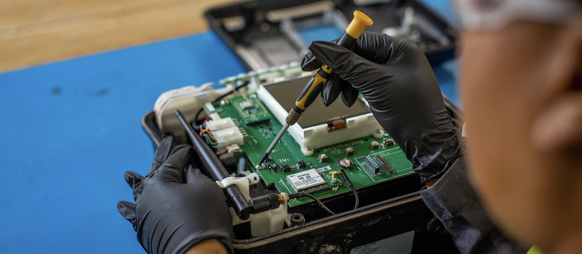 Safety Supply Asset Technician Working on Circuit Board