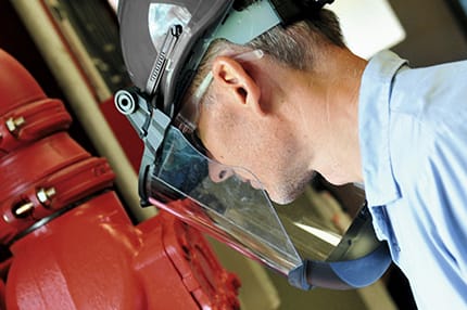 Man Exercising Fire Protection Services With Face Shield