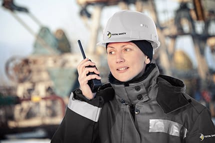 Worker Utilizing 2 Way Radio in Industrial Communication Situation