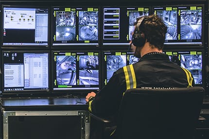 Safety Technician Monitoring Confined Spaces on Monitors