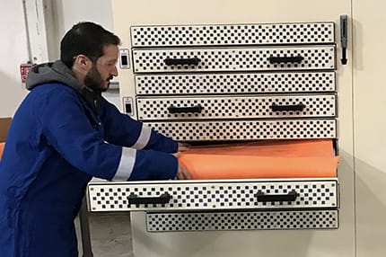 Total Safety Lab Worker Testing Protective Equipment