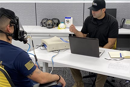 Worker Giving Out Respiratory Protection FIT Certification