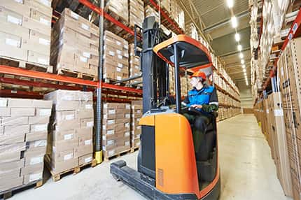 Worker Distributing Safety and MRO Supplies and Equipment with Forklift in Factory