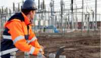 Technician Managing Power Utilities